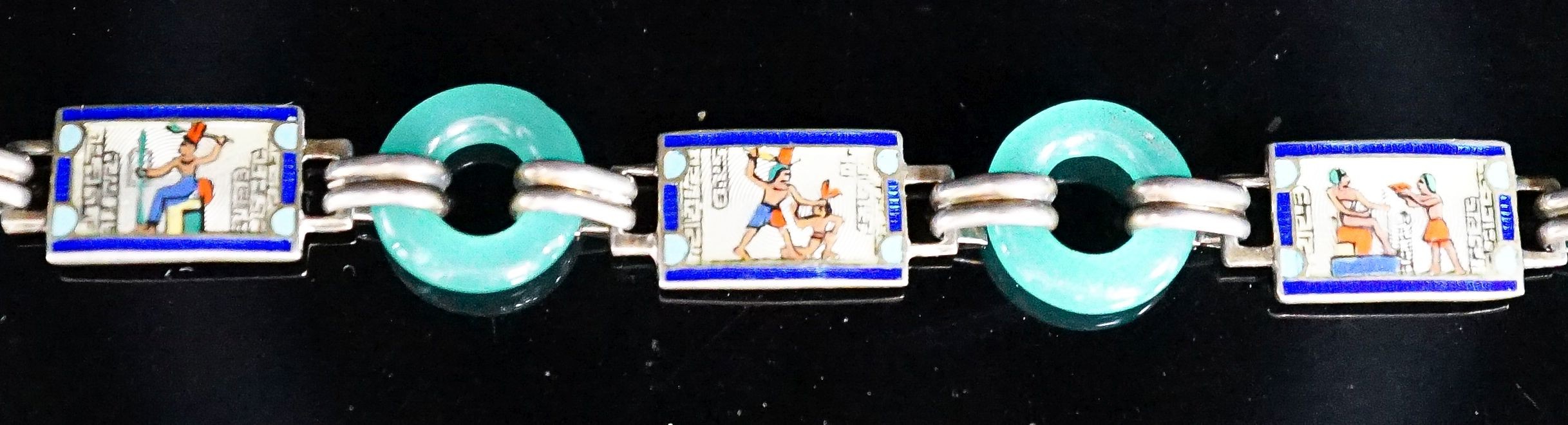 A 20th century Egyptianesque gilt white metal, enamel and chrysoprase loop set bracelet, 18cm.